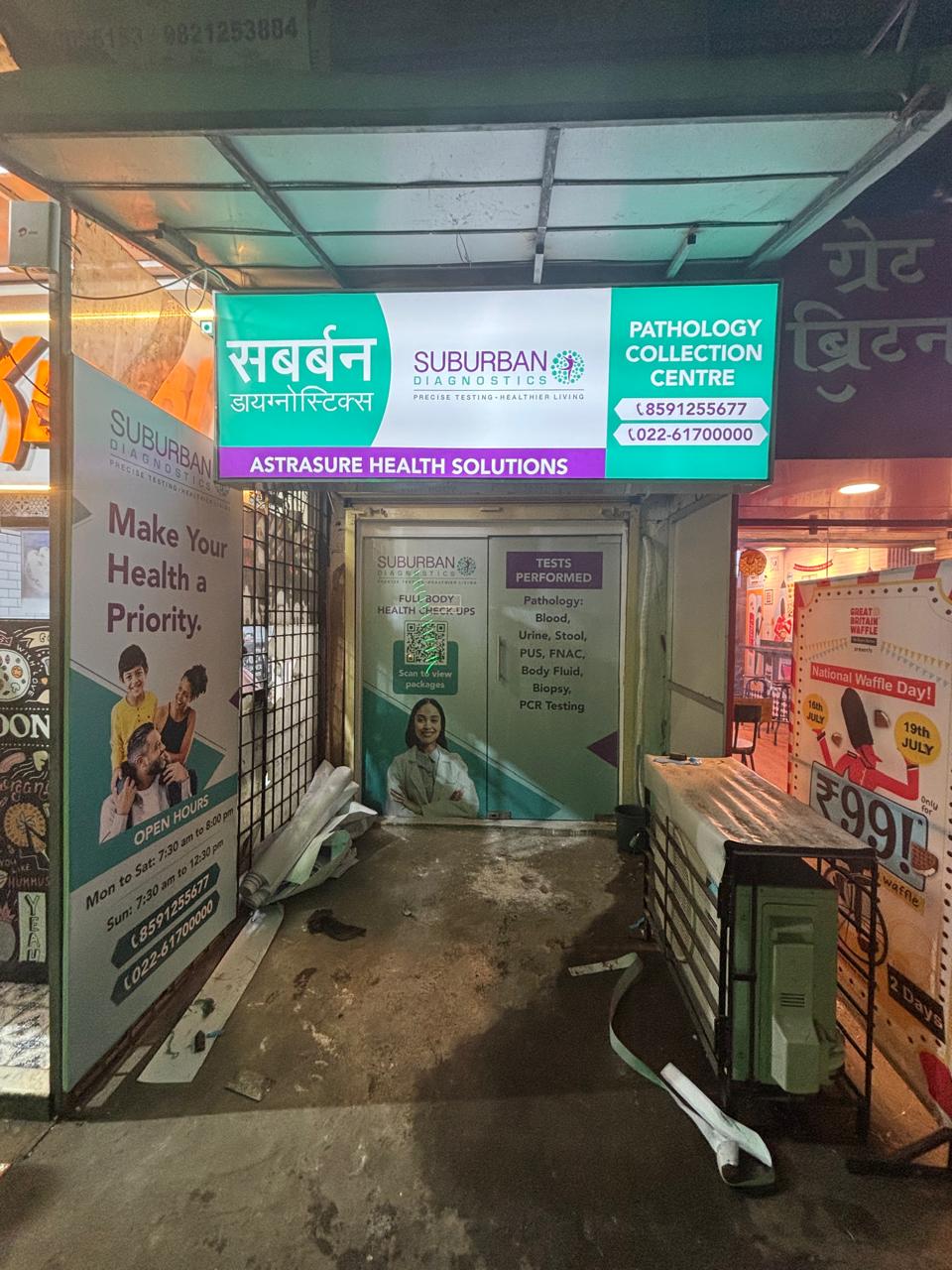 Round glow sign board mounted on a Mumbai building